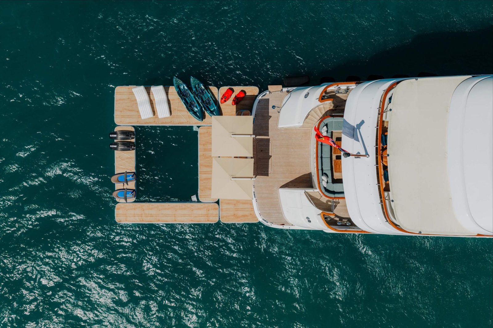 Private yacht with a swim platform and kayaks